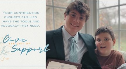 A card reading ‘Give the Gift of Support’ beside a photograph of a young man and a boy